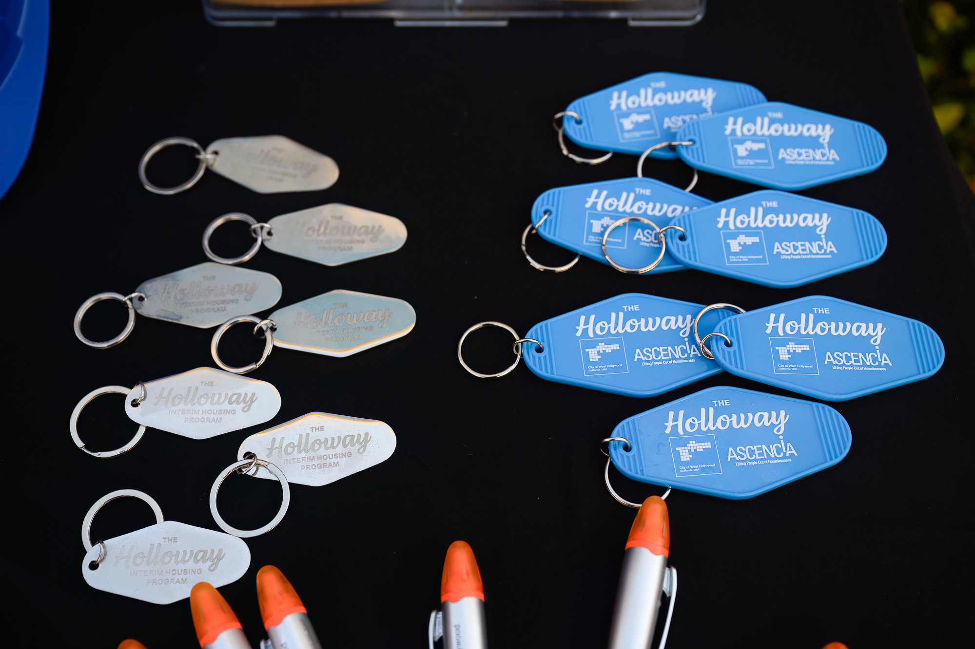 Photograph of Keychains designed by Kilter for the City of West Hollywood's Holloway Interim Housing Program Campaign